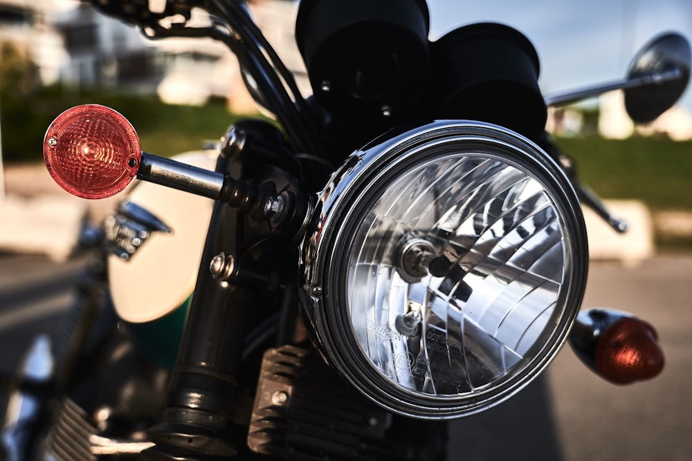 black motorcycle headlight in close up photography