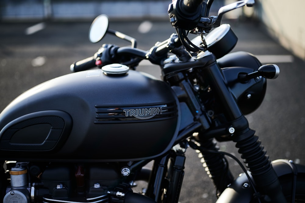 a close up of a motorcycle parked in a parking lot