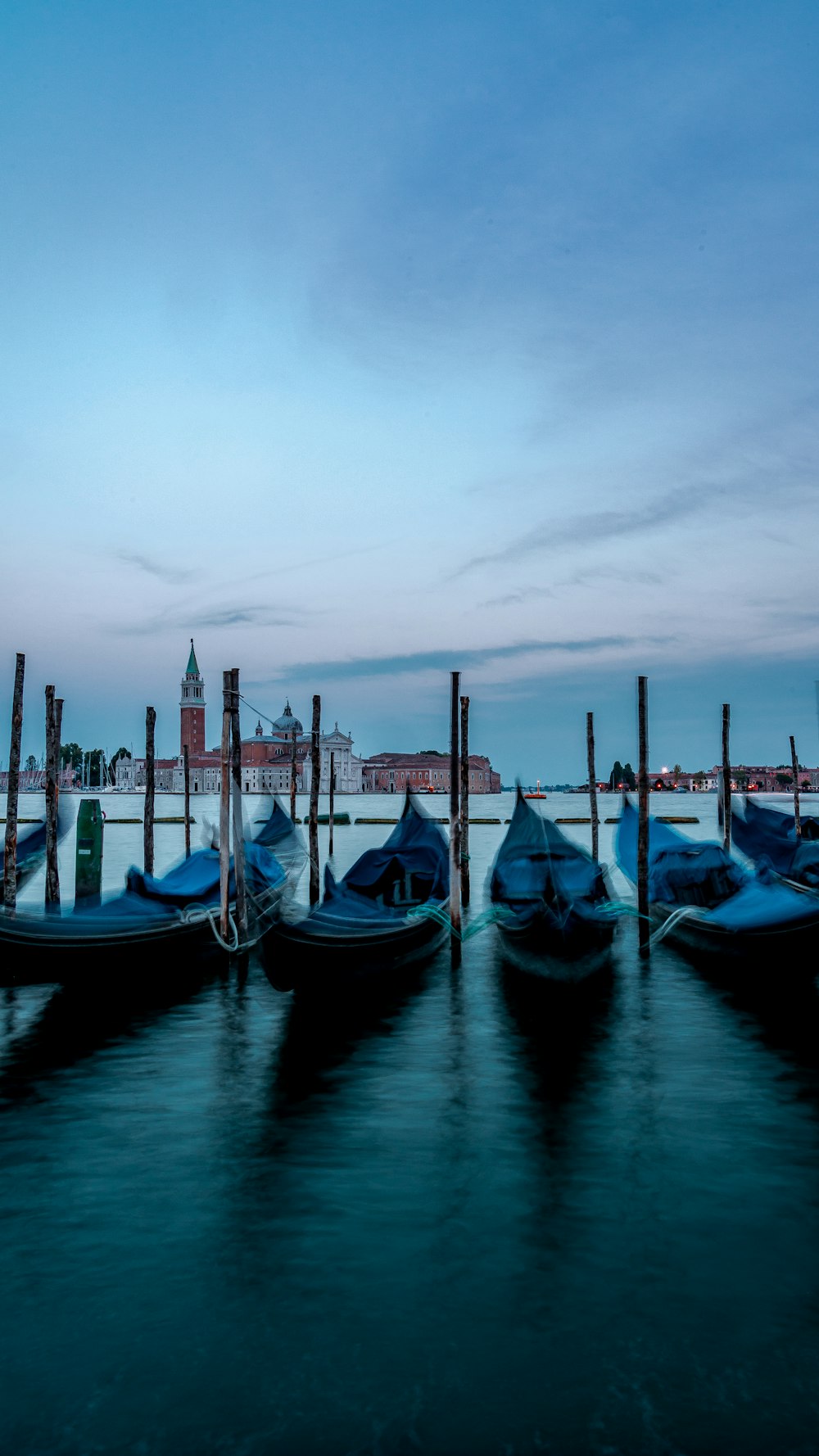 blue and white boat on water during daytime