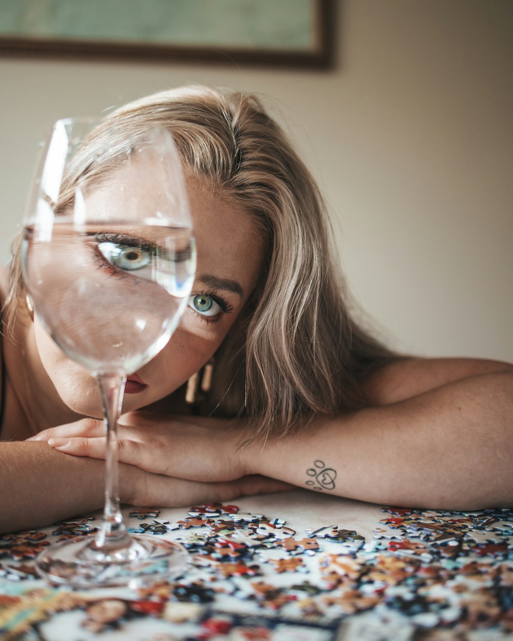 girl lying on bed playing with bubbles