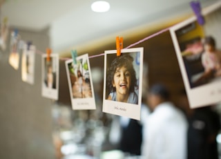 woman in white long sleeve shirt holding white printer paper