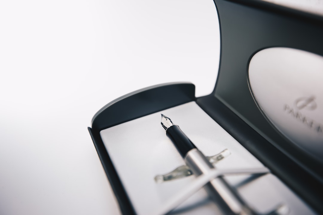 black and silver scissors on white surface