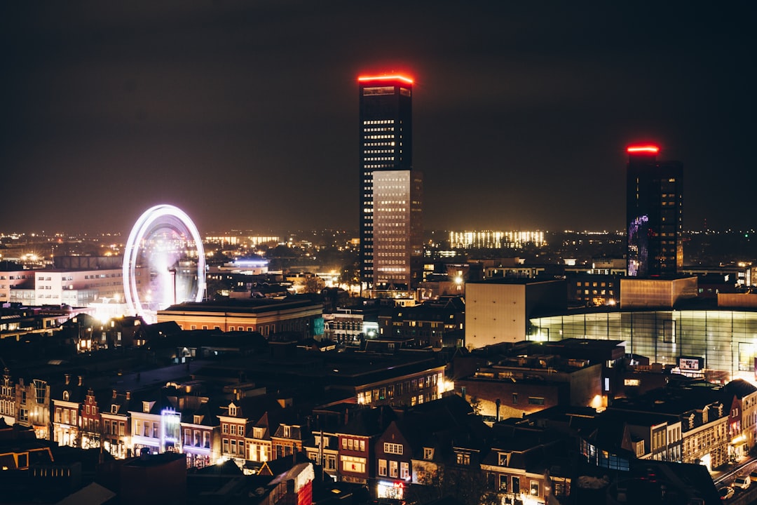 city with high rise buildings during night time