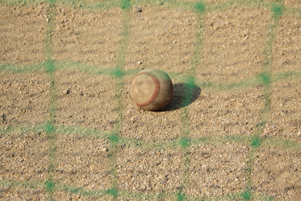 brown baseball on brown field during daytime