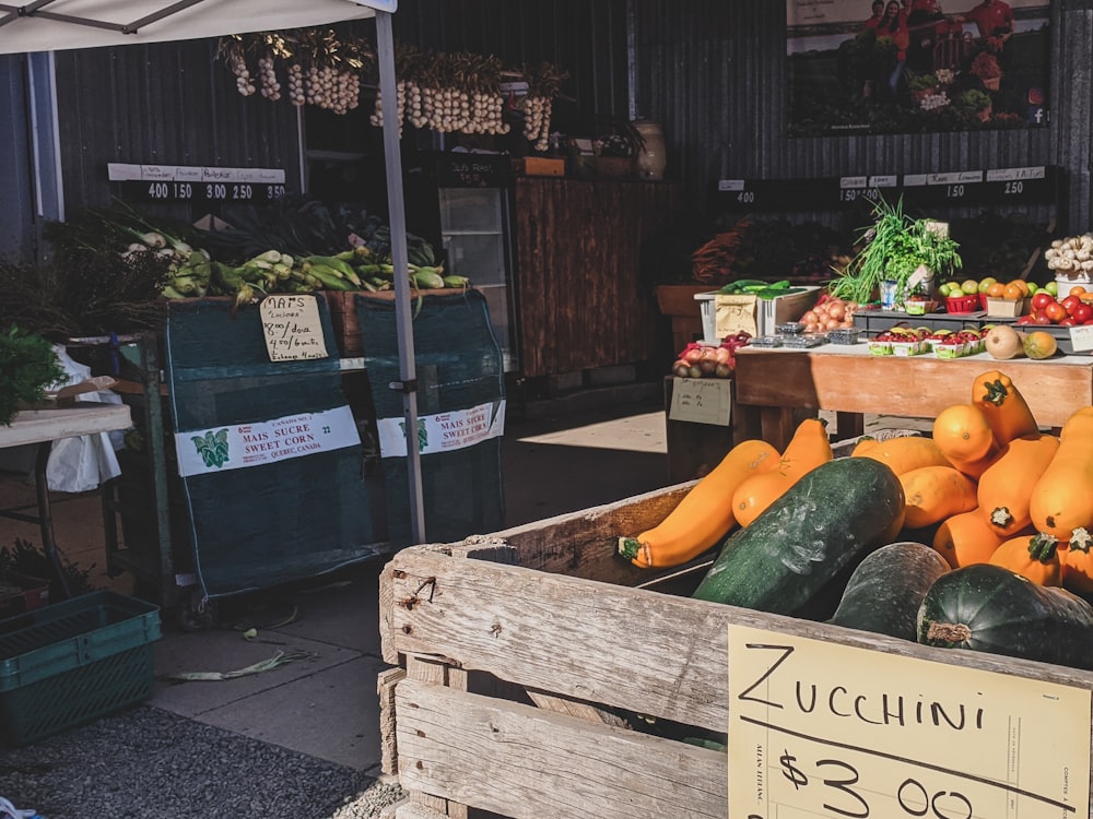 green and yellow vegetable on brown wooden crate