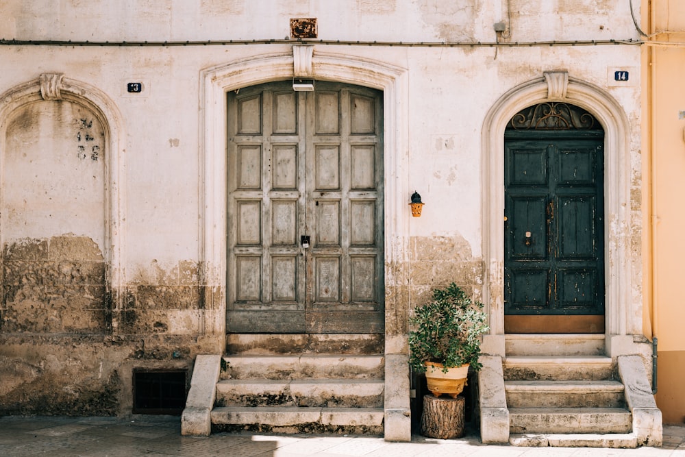 brown wooden door on white concrete building