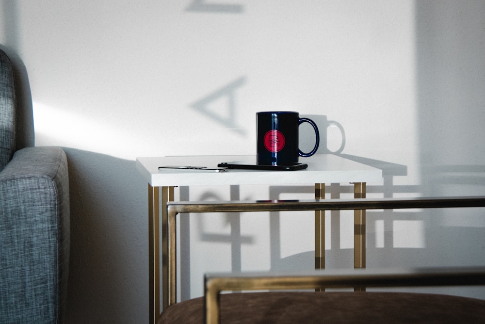 black and red beats by dr dre headphones on brown wooden table