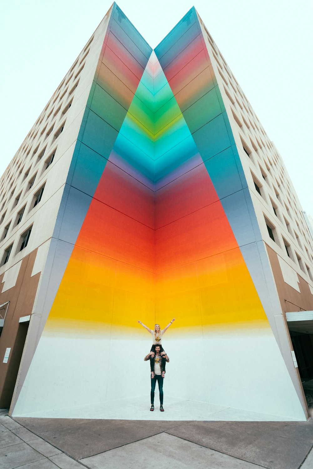 man in black jacket standing on building