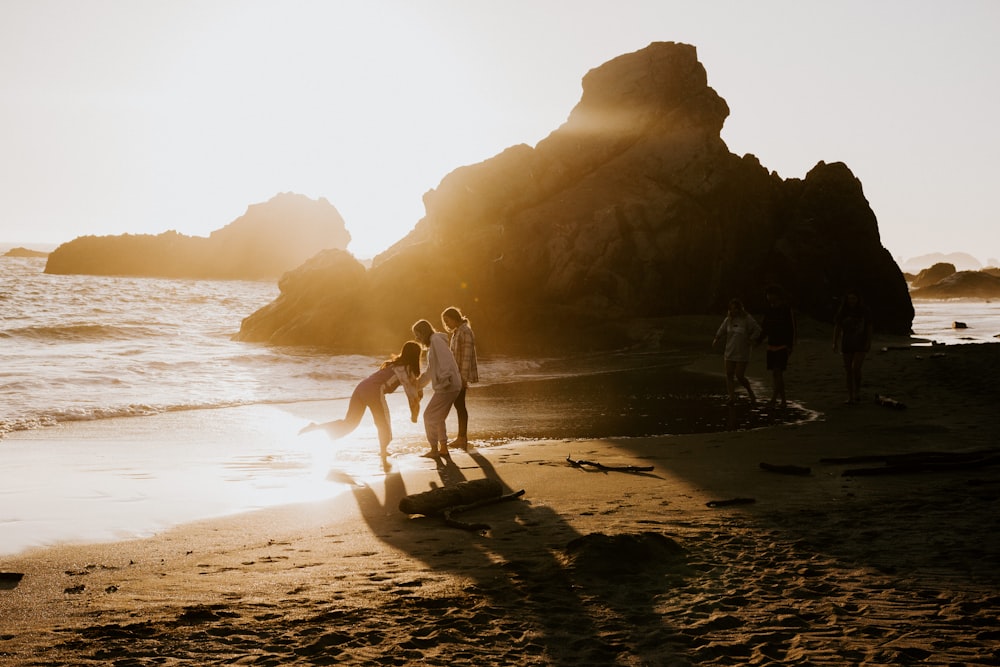 people walking on beach during daytime