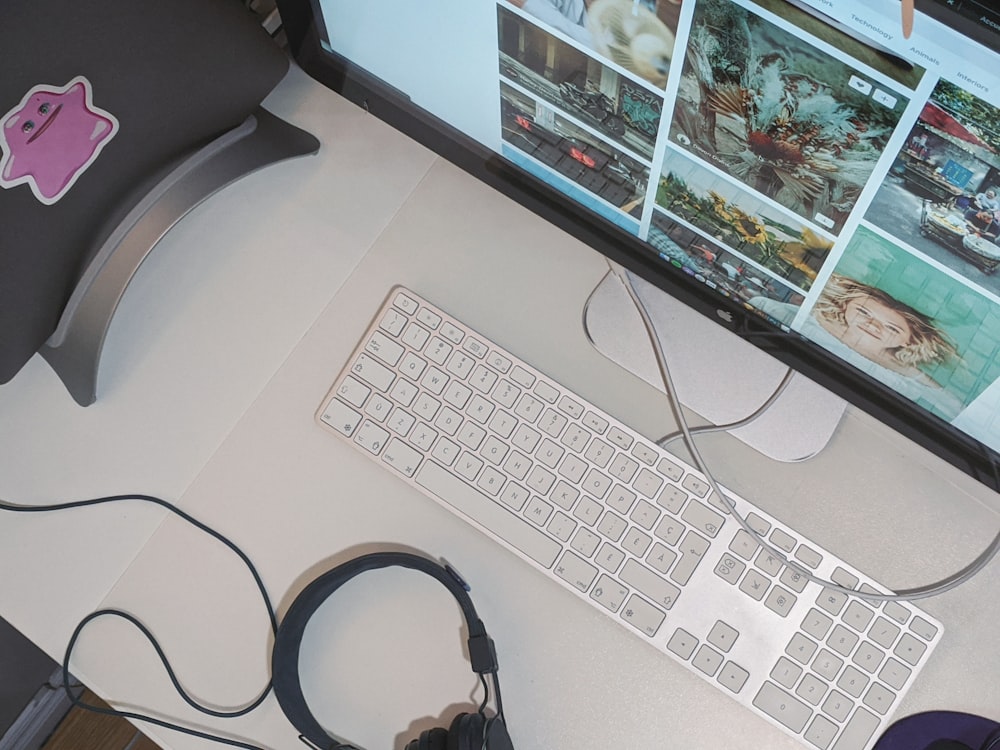 silver imac and apple keyboard