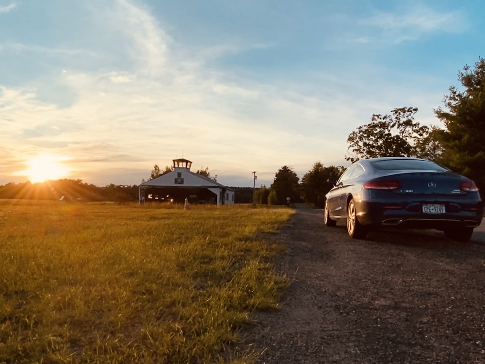 white car on road during sunset