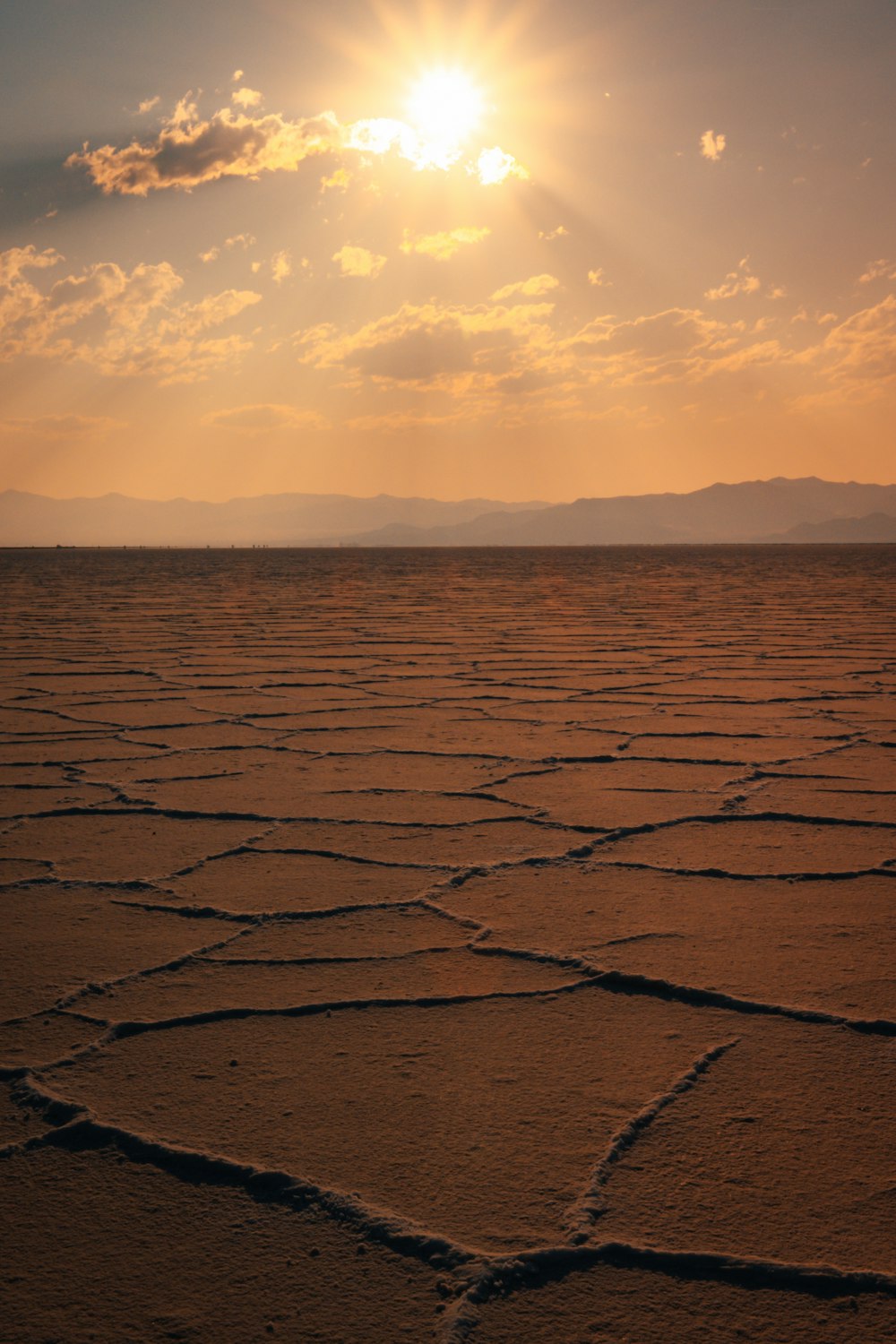 body of water under cloudy sky during sunset