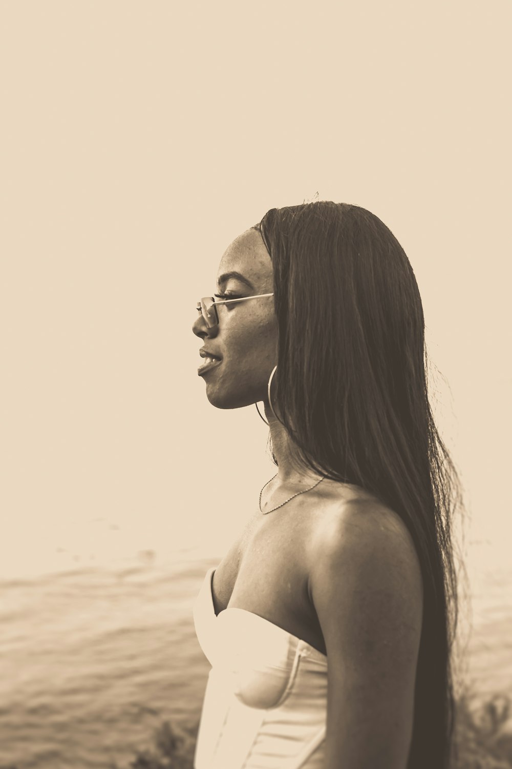 woman in black brassiere and black framed eyeglasses