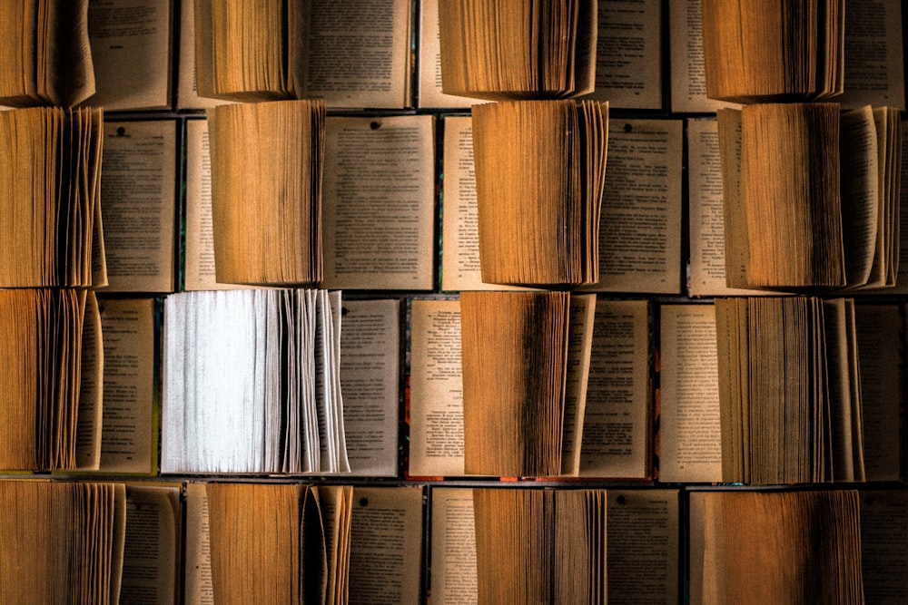 brown wooden book shelf with white paper