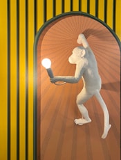 nude woman sitting on brown wicker chair