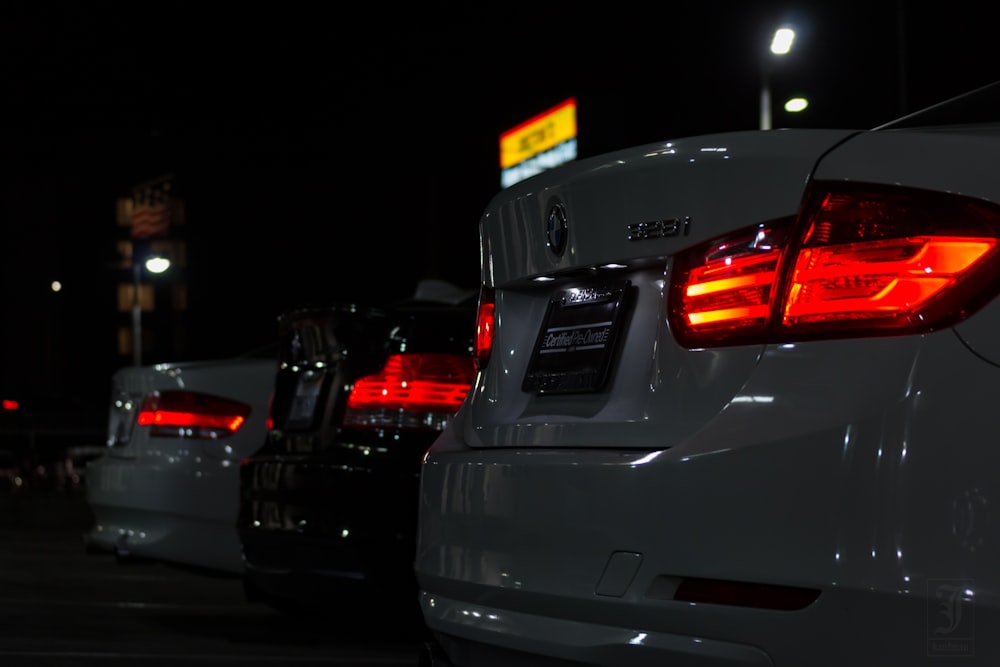 black car on the road during night time