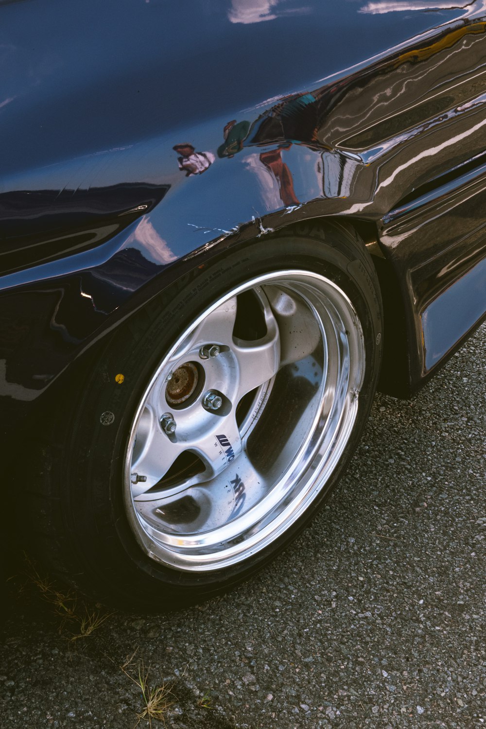 blue and silver car on gray asphalt road during daytime