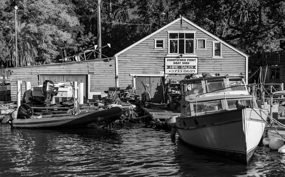 grayscale photo of boat on water