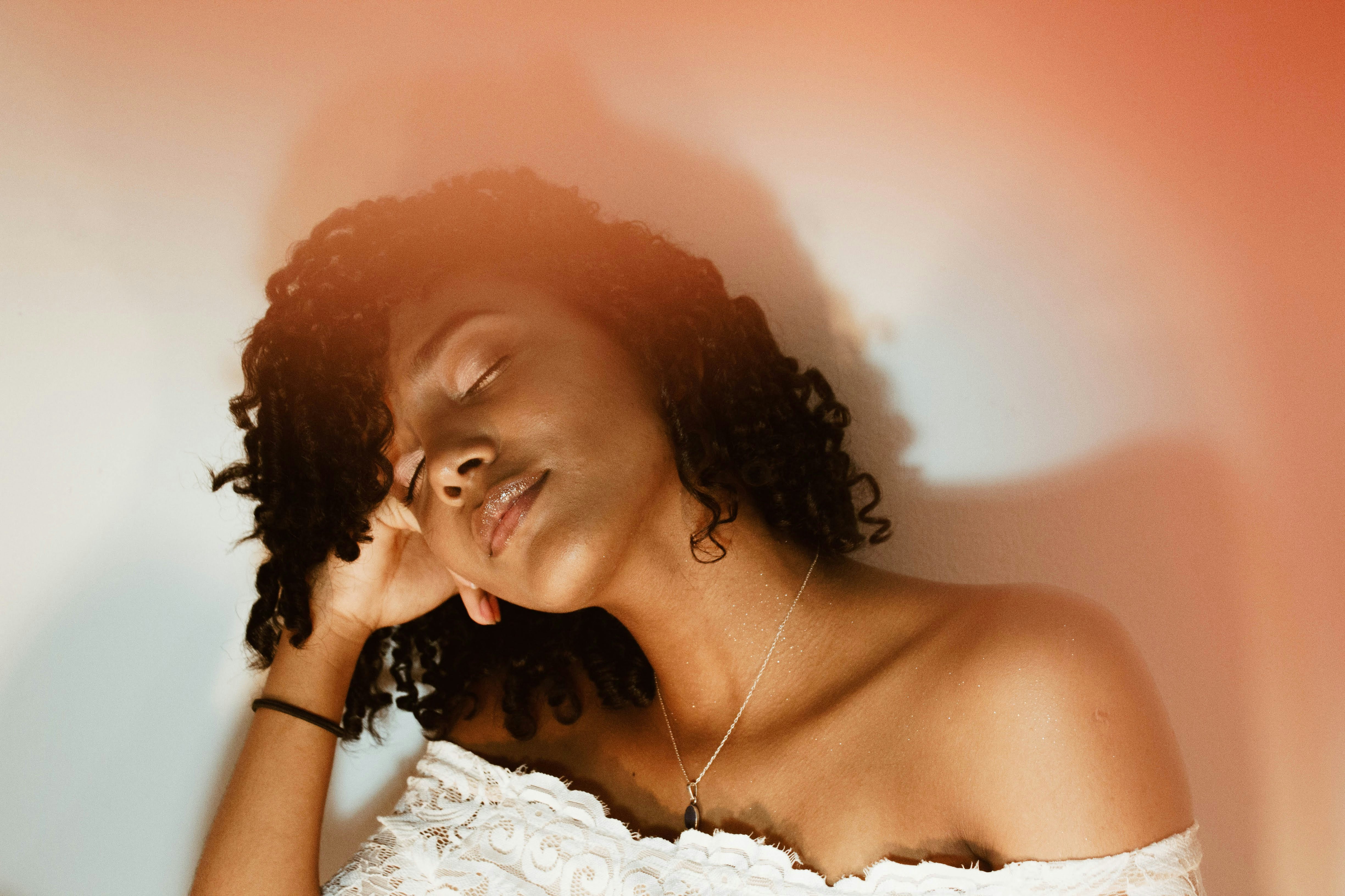 woman in white floral off shoulder top