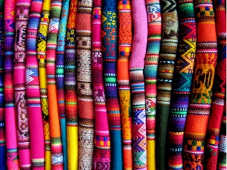 A vibrant display of colorful fabrics arranged neatly.