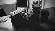 Close-up of a vintage camera and lighting equipment ready for a session.