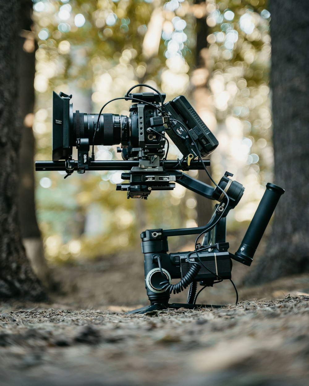 black video camera on brown soil