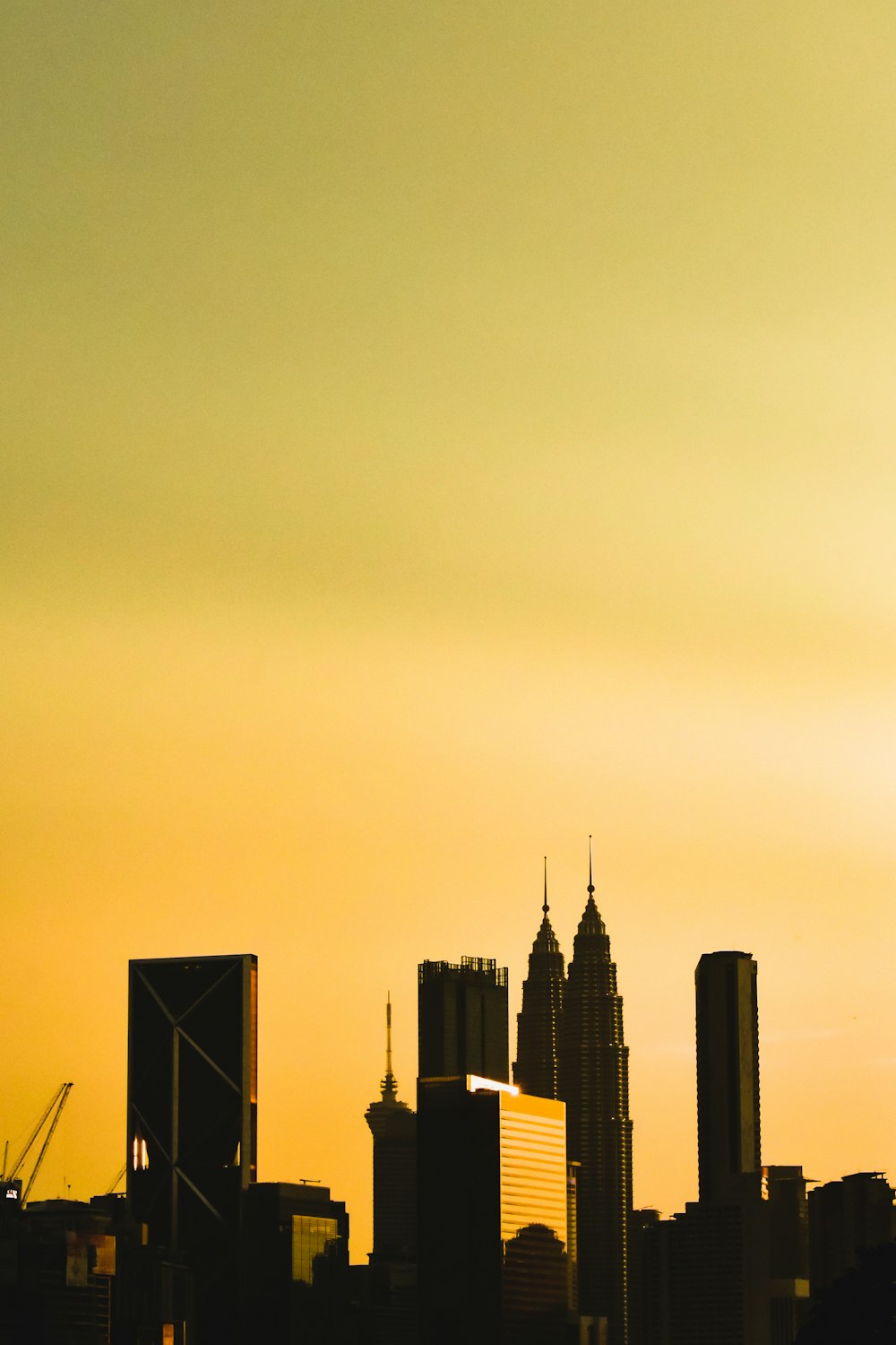 silhouette of city buildings during sunset