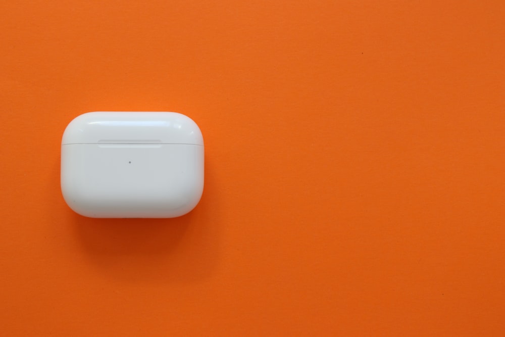 white plastic case on orange surface