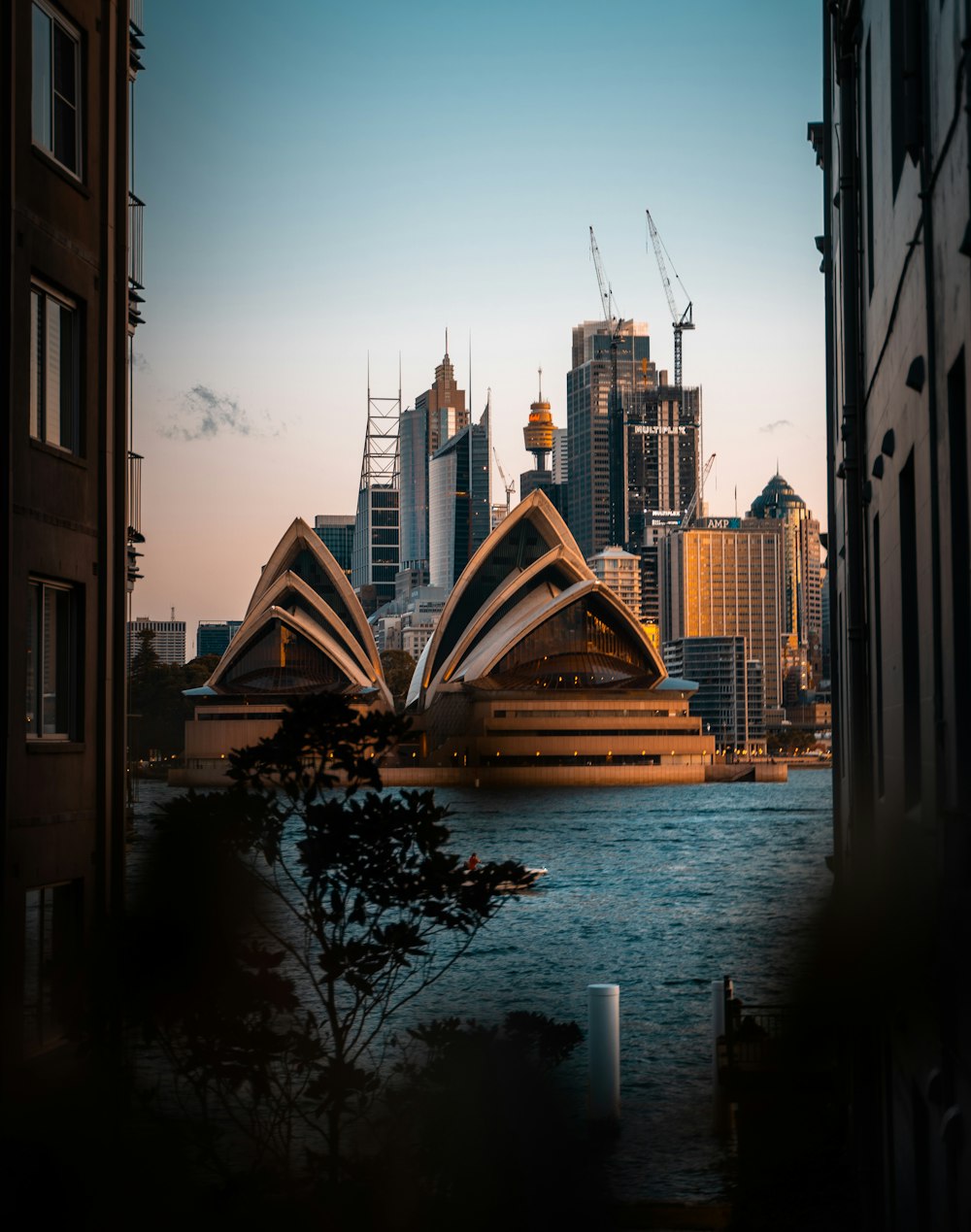 body of water between buildings during daytime