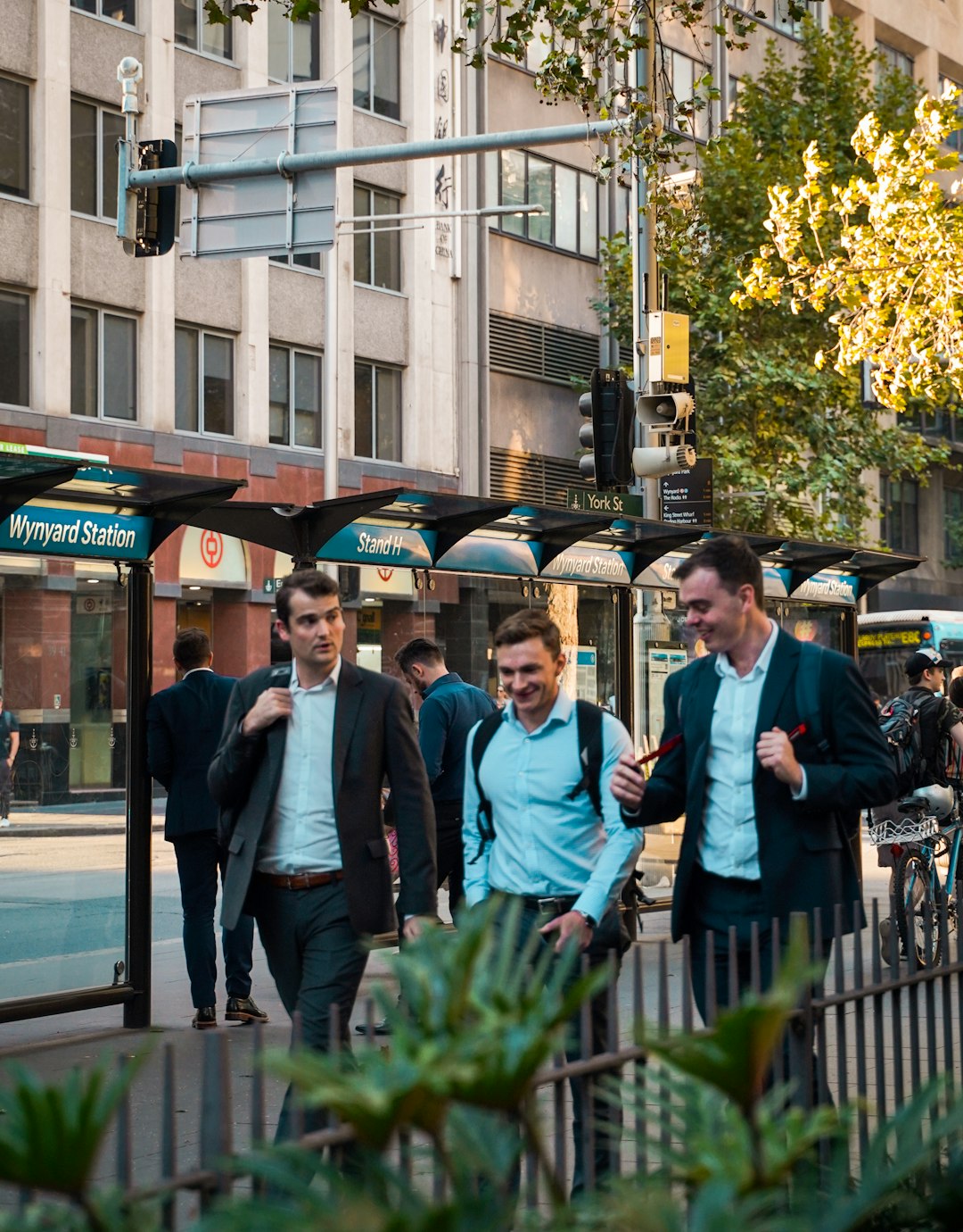 people standing near brown building during daytime