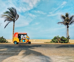 orange and black truck on road during daytime