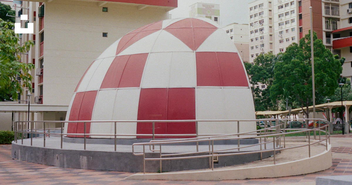 Red Rounded Buildings Red and white round building photo – Free Building Image on Unsplash