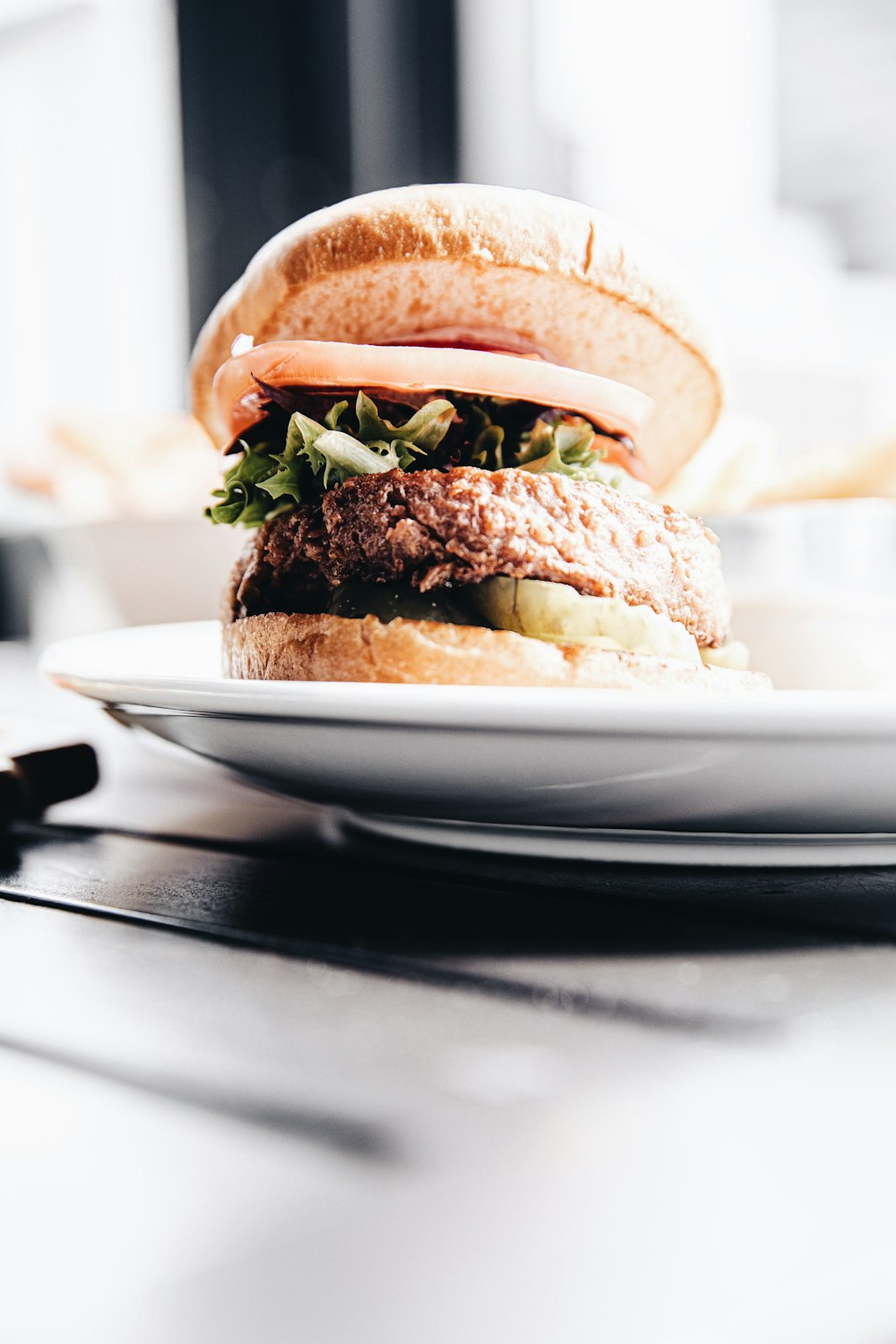 burger on white ceramic plate