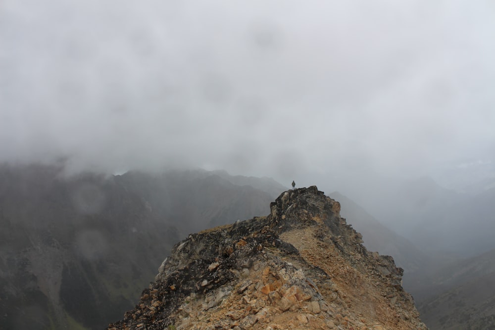 brown rocky mountain under white clouds