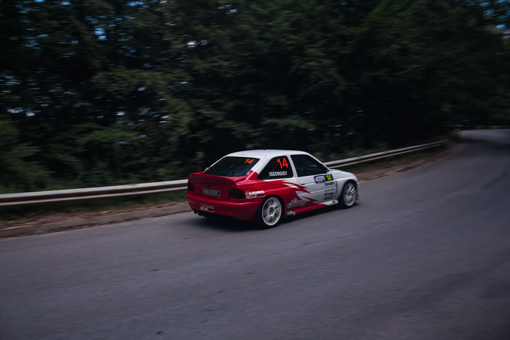 red sedan on road during daytime