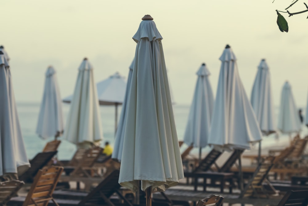 white patio umbrella on brown wooden table