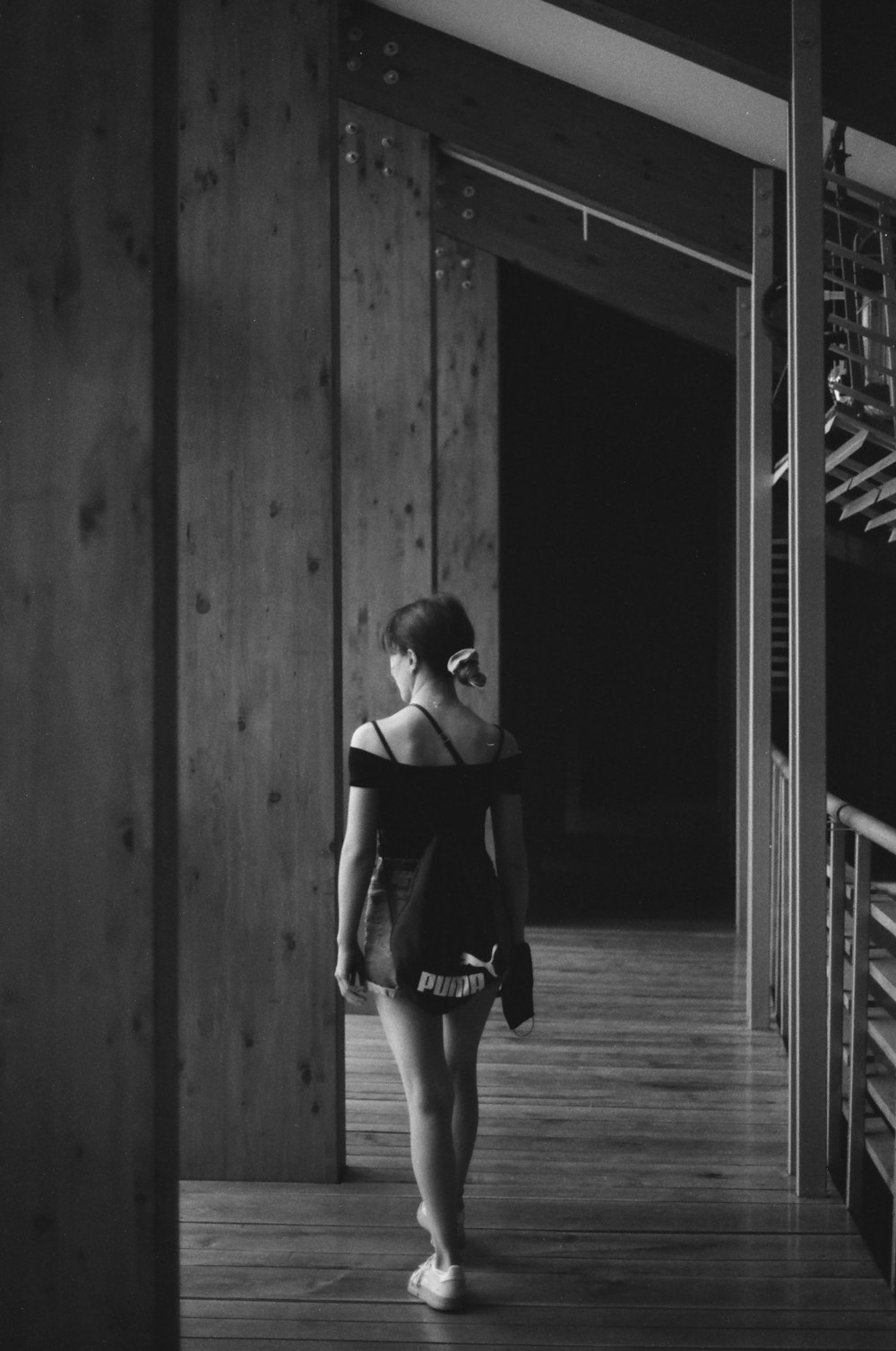 woman in black dress standing in front of door