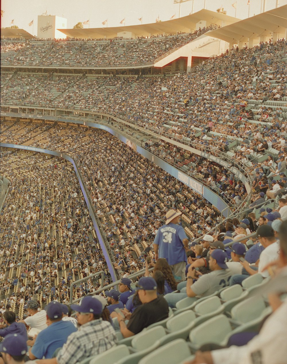 people sitting on blue chairs during daytime