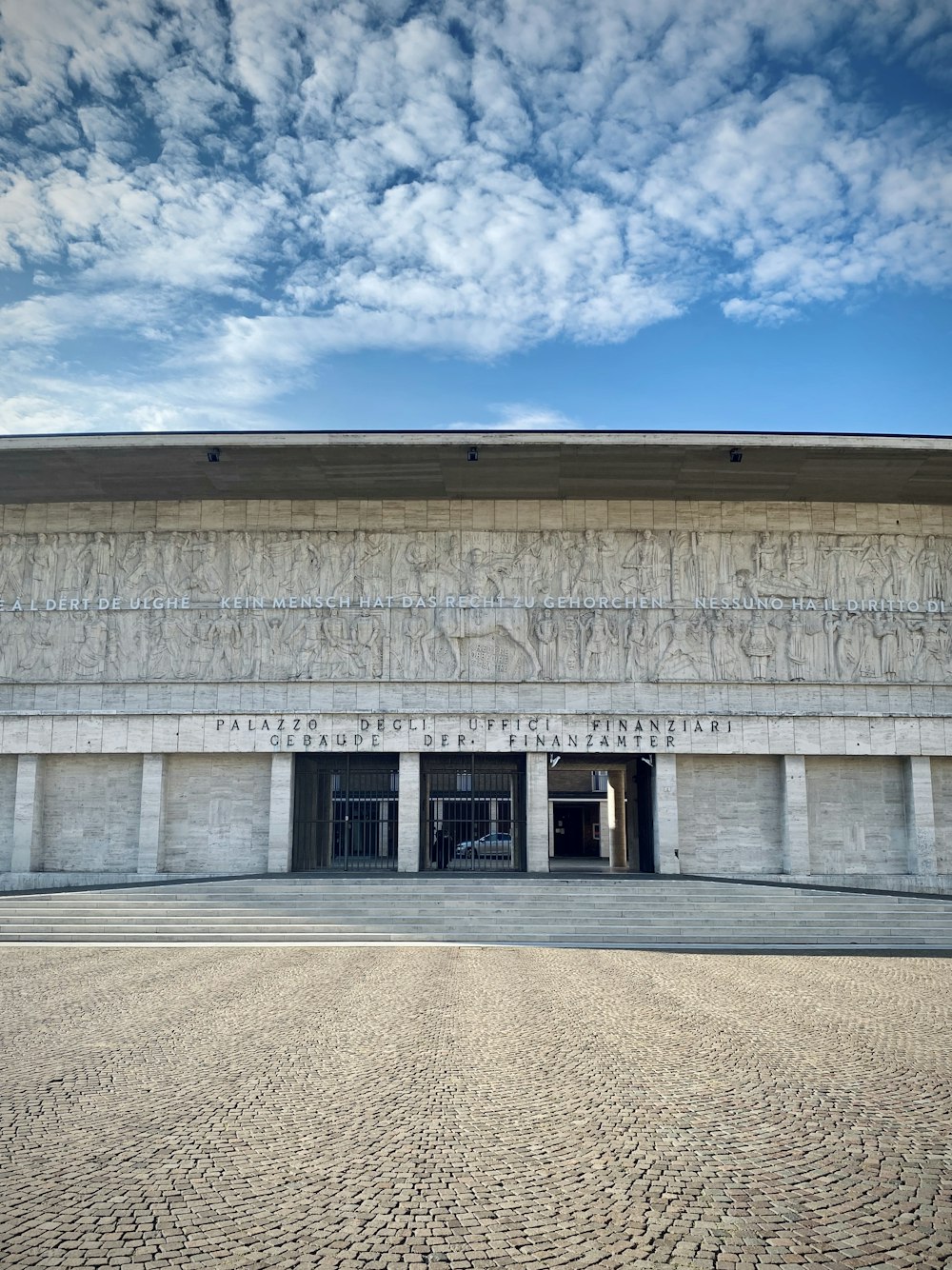 white concrete building under blue sky during daytime