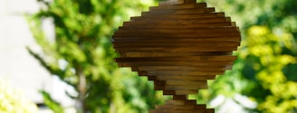 brown wooden round ornament in close up photography