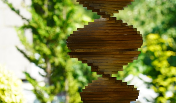 brown wooden round ornament in close up photography