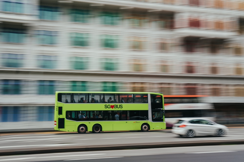 red green and yellow bus on road during daytime