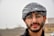 man in black and white knit cap and black framed eyeglasses