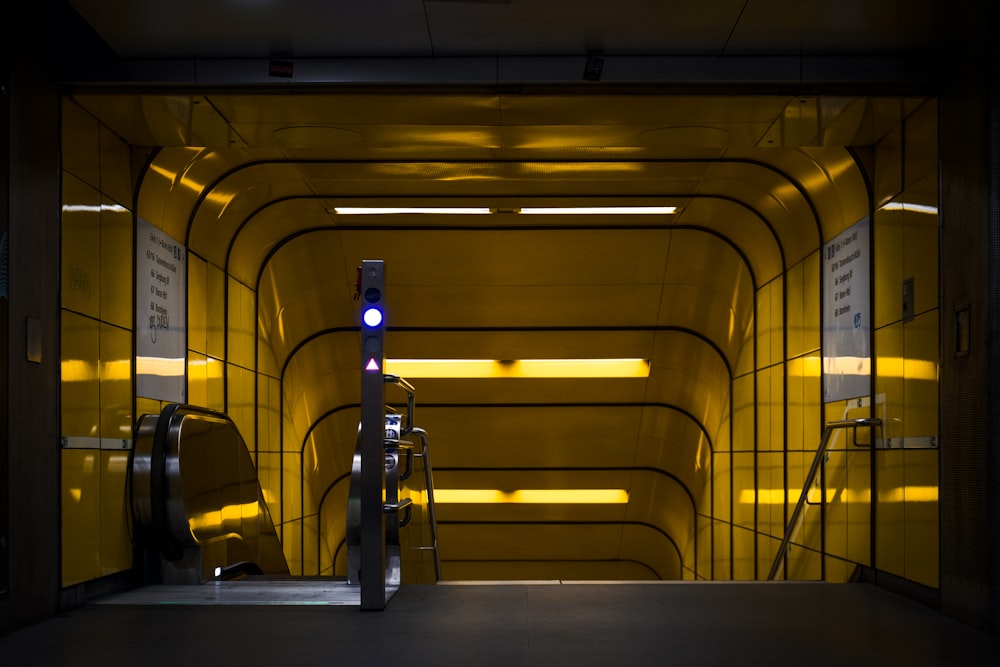 black and gray escalator inside building