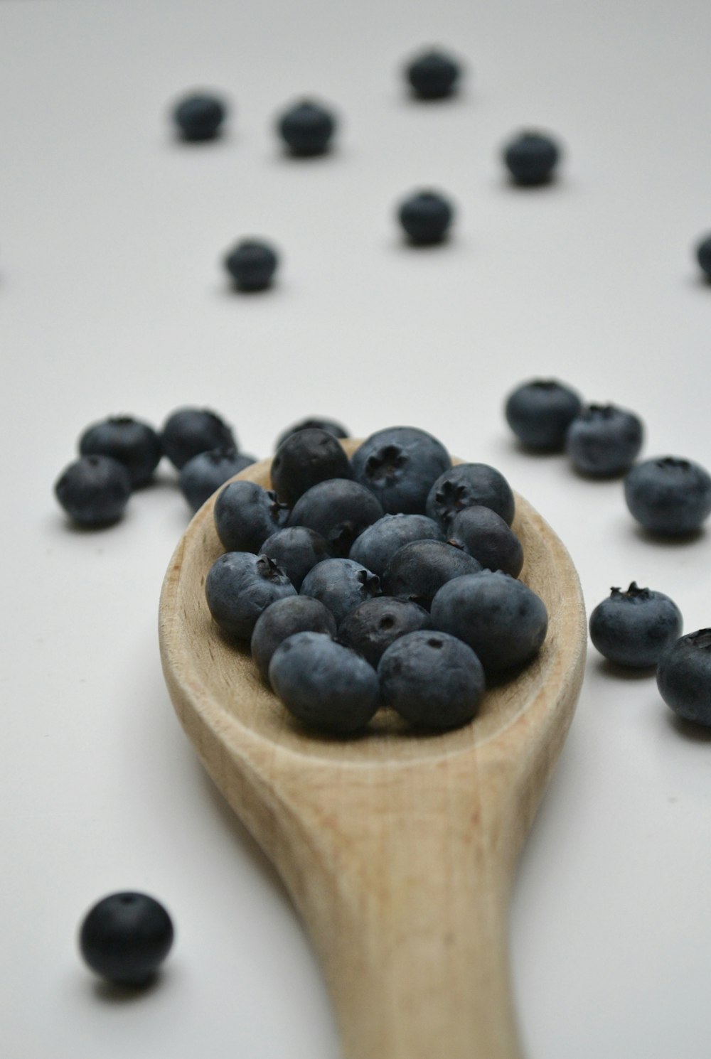 black berries on white ceramic plate