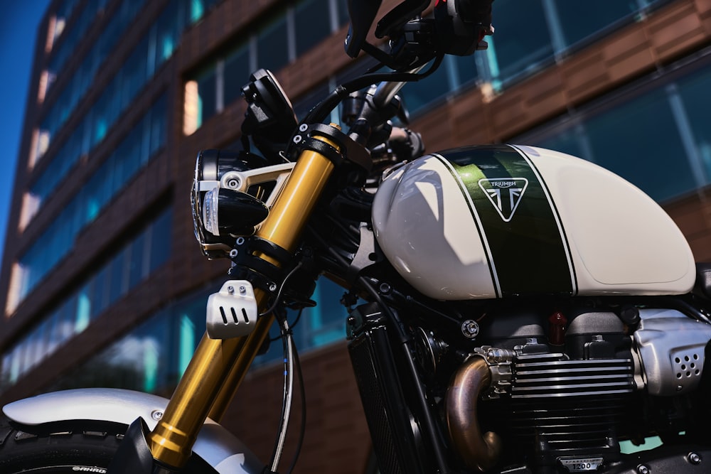 black and silver motorcycle near yellow metal railings