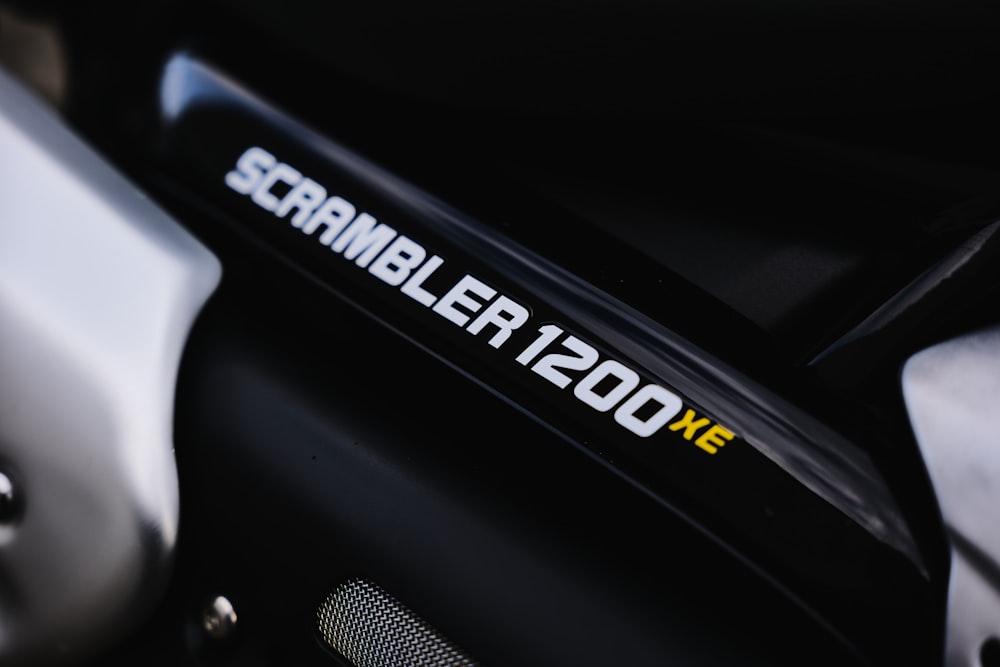 a close up of a scooter with the name scrambler 120xe