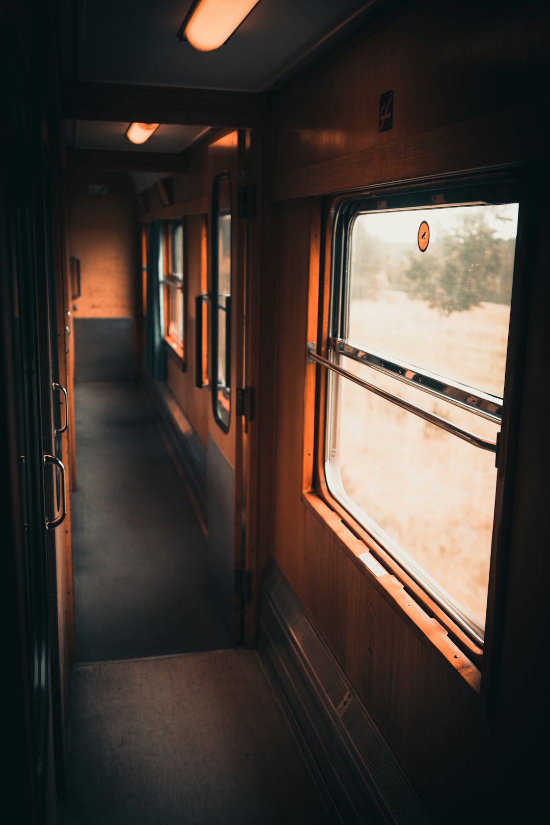 brown wooden train window during daytime