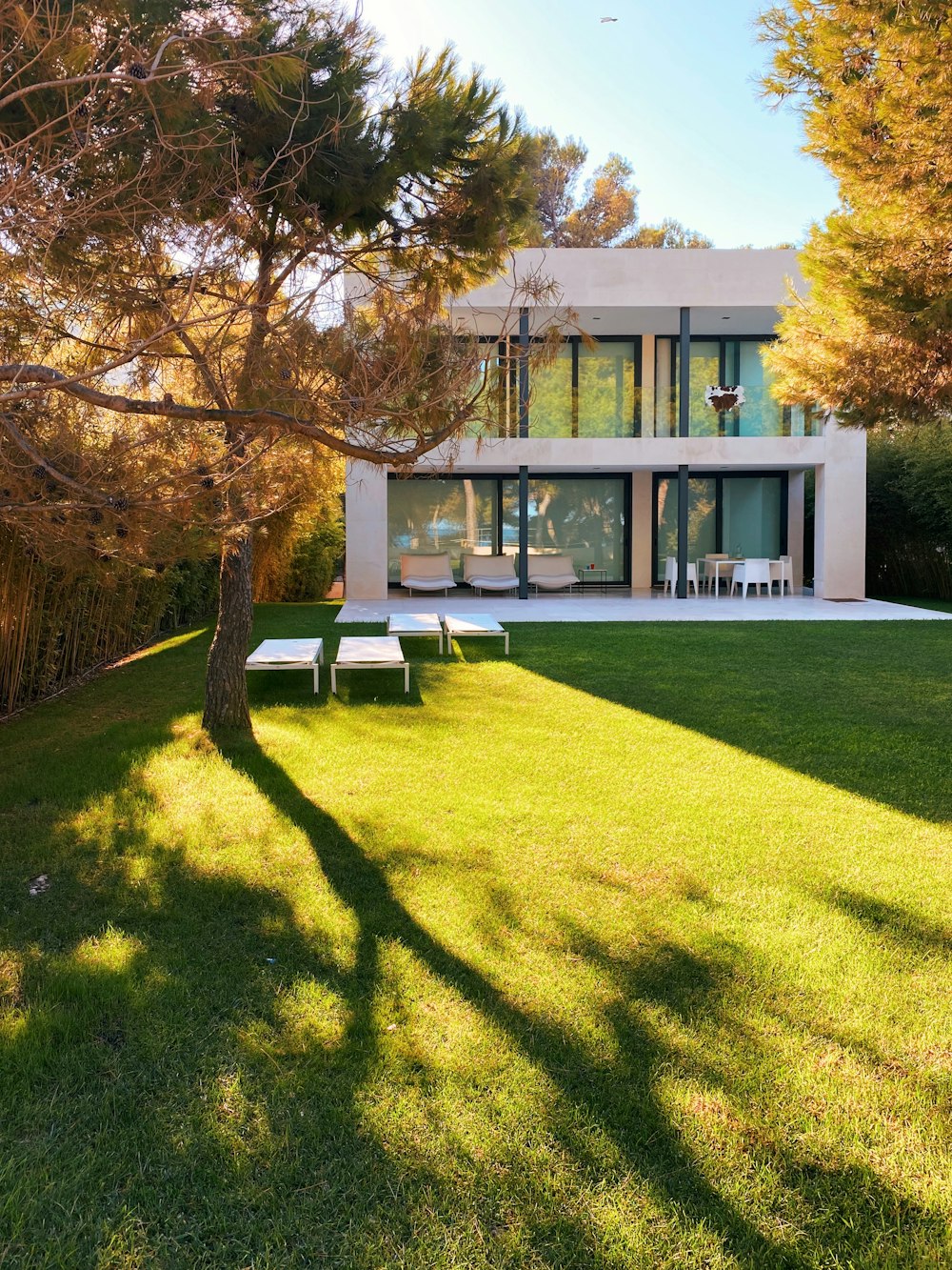 white and brown concrete building near green grass field during daytime