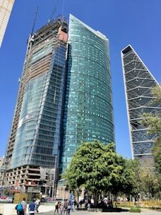 blue glass walled high rise building